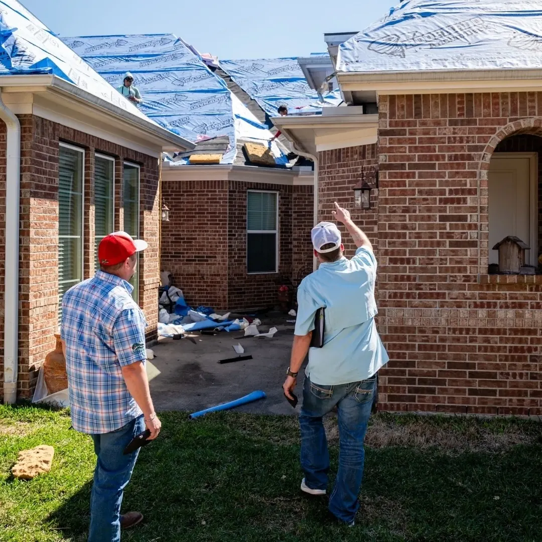 Down South team members inspecting roof underlayment