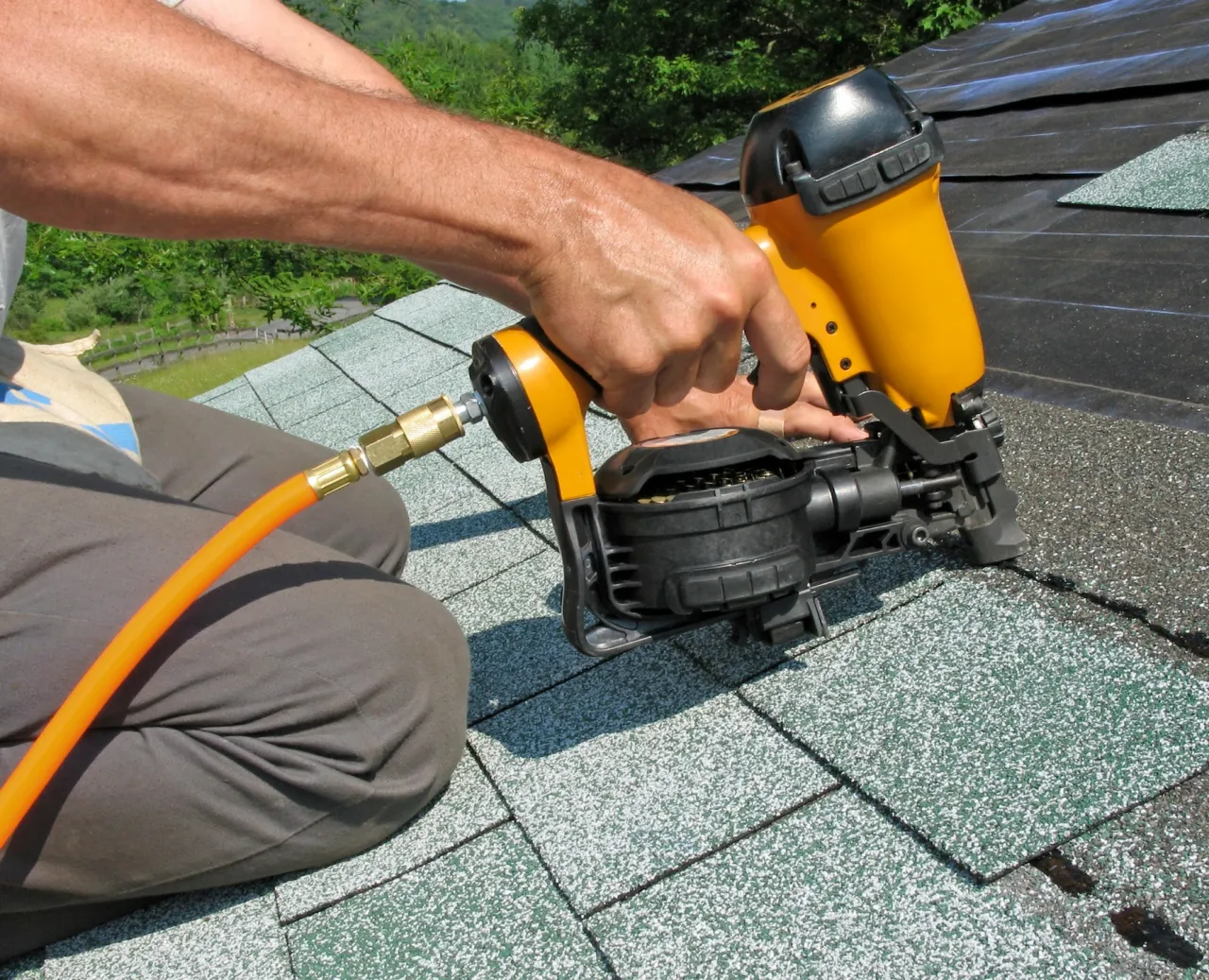 Installing asphalt shingles with a roofing nailer